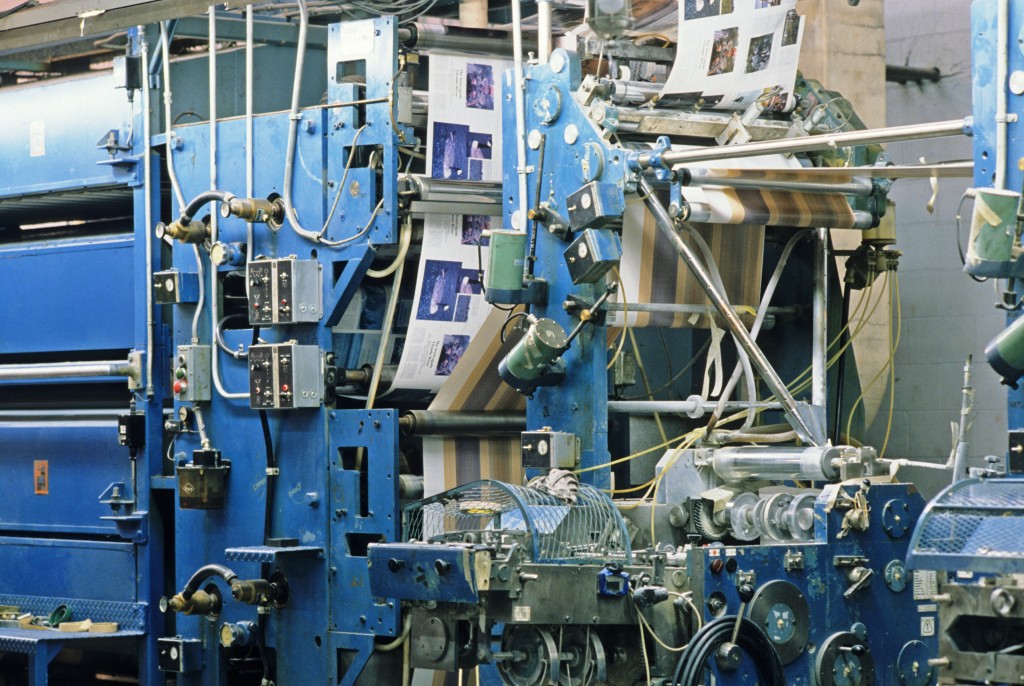 Photograph of a large printing press printing the Wisconsin Natural Resources magazine at Straus Printing in Madison.