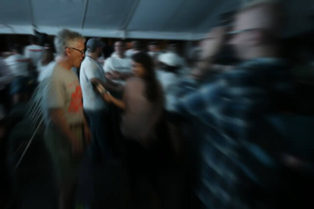 new experiences at meetings: a blurred image of two people meeting and connecting in a crowd